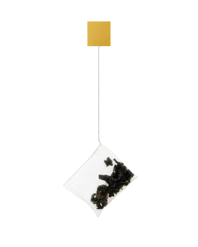 OriaTea cotton-stitched premium tea bag with kraft tag — complete product assembly showcasing biodegradable mesh, cotton thread, kraft tag and glue-free closure